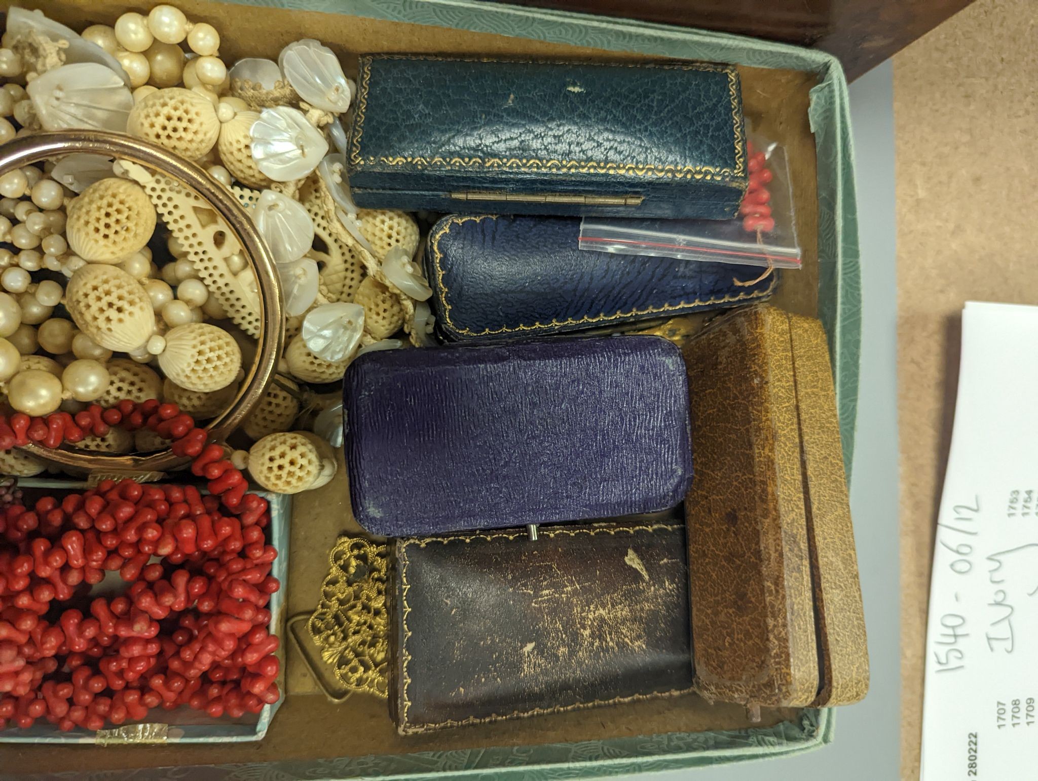 A quantity of assorted Victorian and later jewellery including costume and filigree and a 19th century tea caddy with conch shell inlay.